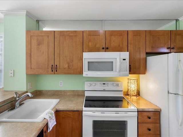 kitchen with sink and white appliances