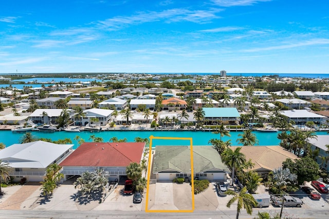 aerial view featuring a water view and a residential view