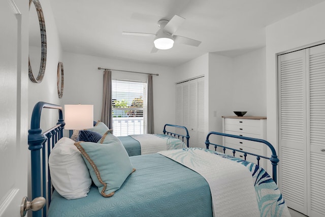 bedroom featuring two closets and ceiling fan