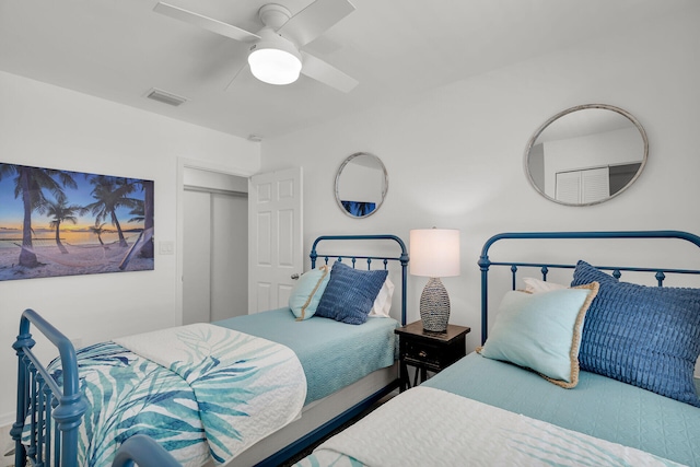 bedroom featuring a ceiling fan and visible vents