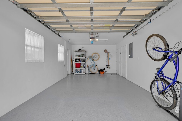 garage featuring a garage door opener and electric panel