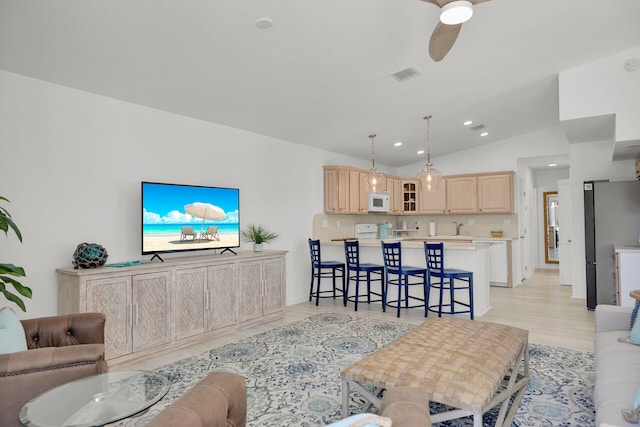 630 10th St, Key Colony, FL 33051 - living room featuring vaulted ceiling, a ceiling fan, light wood-style floors, and recessed lighting