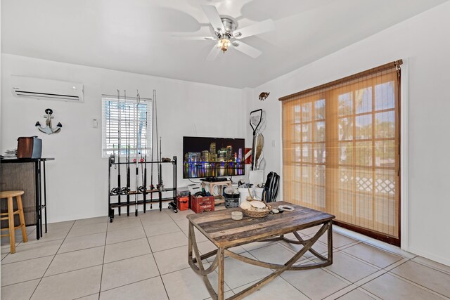 living room featuring light tile patterned floors, a wall mounted air conditioner, and ceiling fan