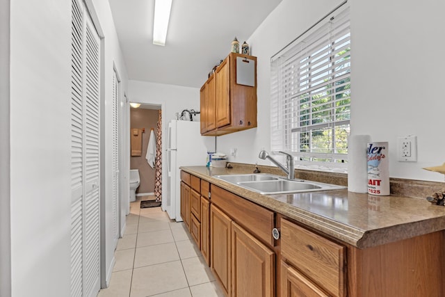 kitchen with sink and light tile patterned floors