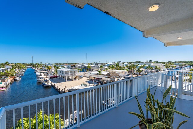 balcony featuring a water view