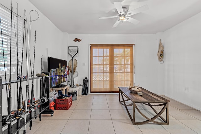 interior space featuring plenty of natural light, ceiling fan, and light tile patterned flooring