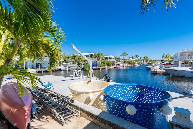 view of pool with a dock and a water view