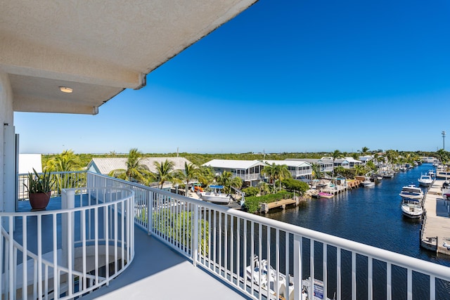 balcony featuring a water view