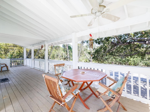 wooden deck with a ceiling fan