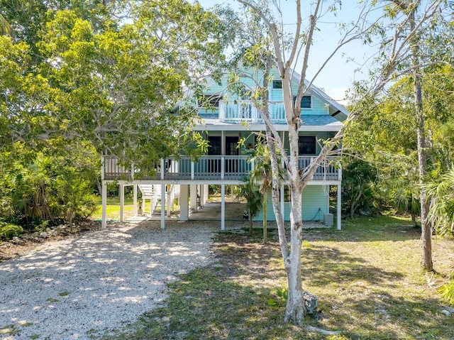 beach home with a carport and driveway