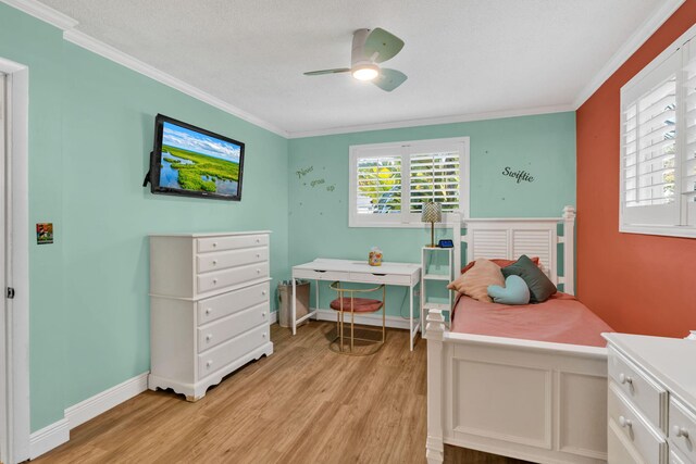 bedroom with ornamental molding, light wood-type flooring, and baseboards