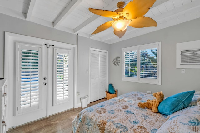 bedroom with access to exterior, french doors, wood finished floors, wooden ceiling, and beamed ceiling