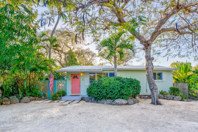 single story home with fence