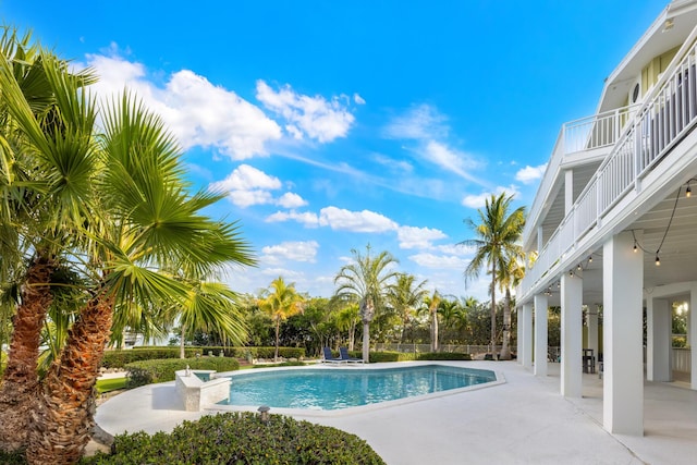 view of pool featuring a patio