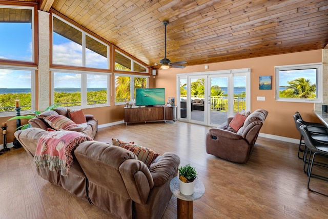 living room featuring french doors, high vaulted ceiling, wood ceiling, and hardwood / wood-style floors