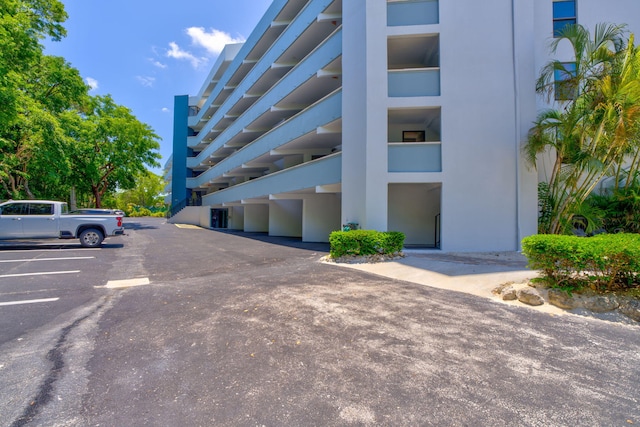 104350 Overseas Hwy Unit B203, Key Largo, FL 33037 - view of building exterior with uncovered parking