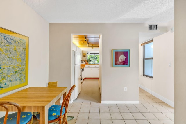 104350 Overseas Hwy Unit B203, Key Largo, FL 33037 - dining area featuring light tile patterned floors and a textured ceiling