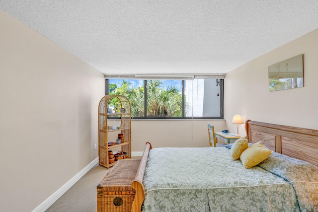 104350 Overseas Hwy Unit B203, Key Largo, FL 33037 - carpeted bedroom featuring baseboards and a textured ceiling