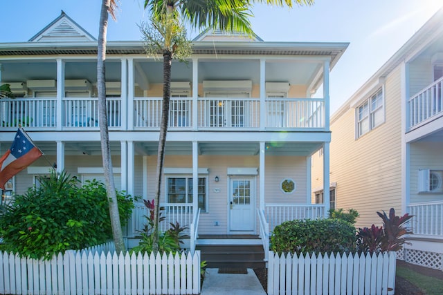 view of front of home featuring a balcony and covered porch