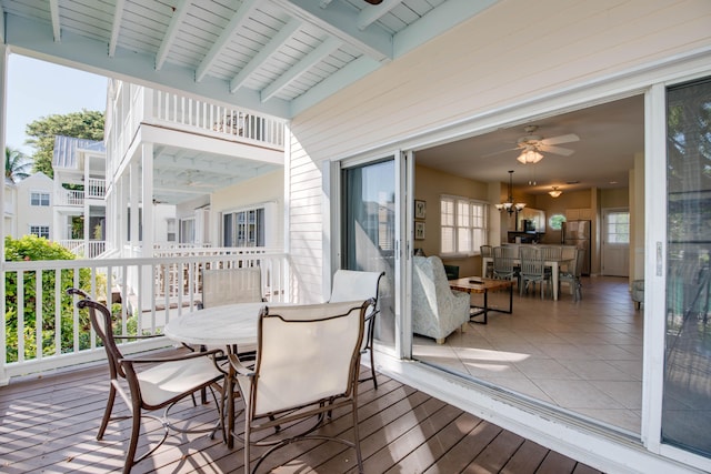 wooden deck featuring ceiling fan