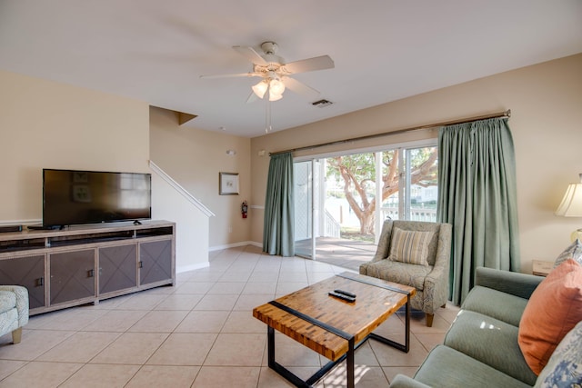 living room with ceiling fan and light tile patterned floors