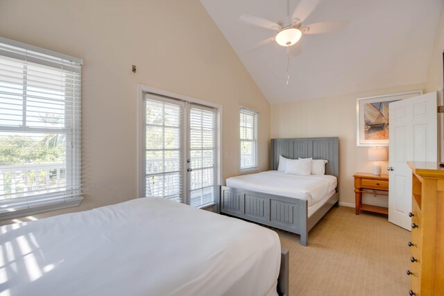 bedroom featuring high vaulted ceiling, access to outside, light colored carpet, and ceiling fan