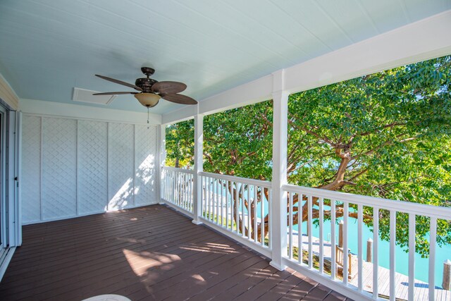 wooden deck featuring ceiling fan