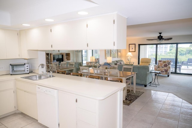 88181 Old Hwy Unit 3F, Islamorada, FL 33036 - kitchen featuring white dishwasher, open floor plan, a peninsula, light tile patterned floors, and light countertops