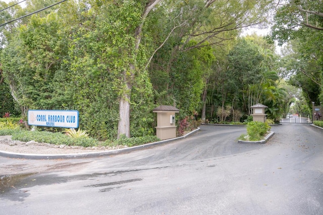 88181 Old Hwy Unit 3F, Islamorada, FL 33036 - view of asphalt street featuring curbs and a gated entry