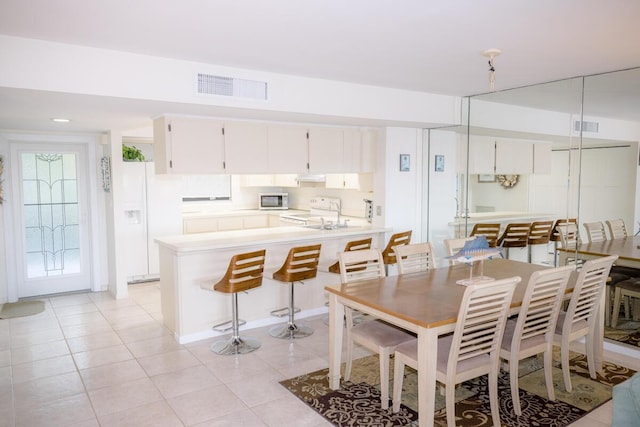 88181 Old Hwy Unit 3F, Islamorada, FL 33036 - dining area with light tile patterned floors