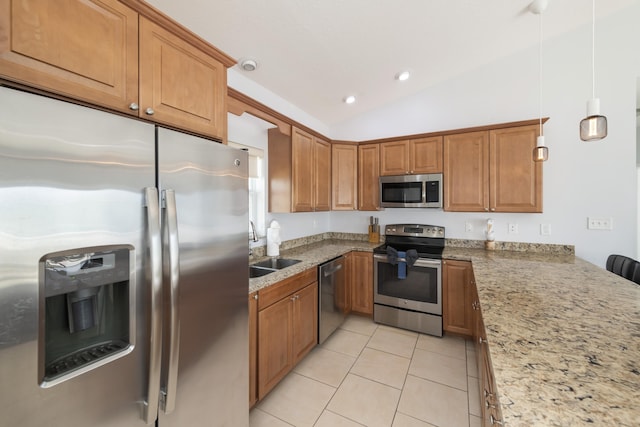 kitchen with light tile patterned flooring, lofted ceiling, sink, appliances with stainless steel finishes, and pendant lighting