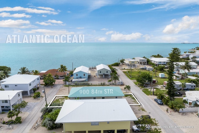 birds eye view of property featuring a water view and a residential view