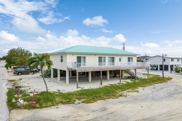 view of front of home featuring a carport