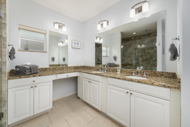 bathroom with vanity, tile patterned flooring, and a shower with shower door