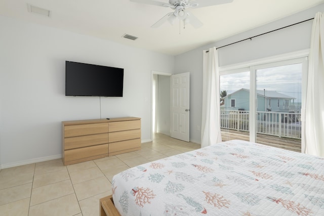 tiled bedroom featuring ceiling fan and access to outside