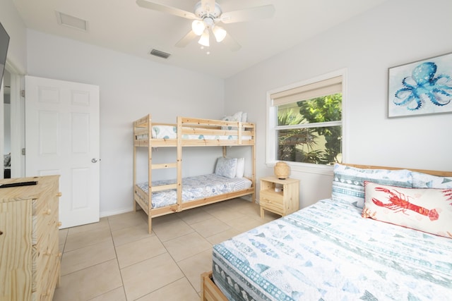 bedroom featuring light tile patterned floors and ceiling fan