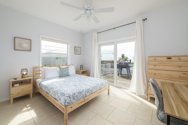 tiled bedroom featuring multiple windows, access to outside, and ceiling fan