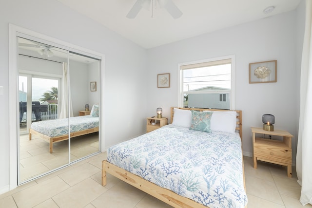 bedroom with tile patterned floors, a closet, and ceiling fan