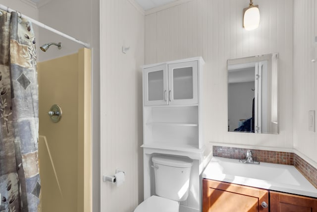 bathroom featuring vanity, toilet, and a shower with shower curtain