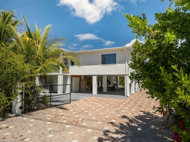 rear view of property with a carport