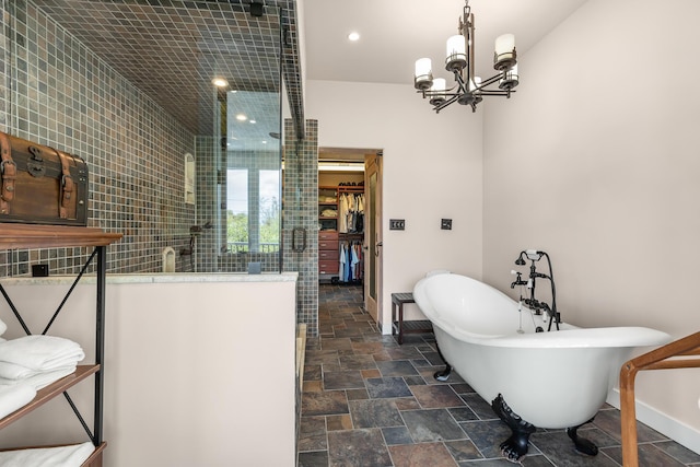 bathroom with plus walk in shower and a chandelier