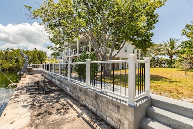 exterior space featuring a yard and a water view