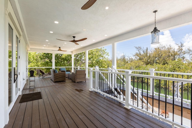 wooden deck with ceiling fan