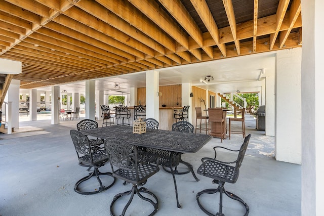 view of patio with a bar and grilling area