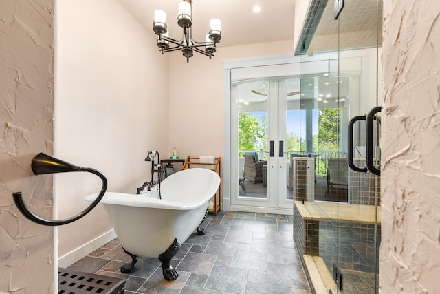 bathroom featuring a notable chandelier, shower with separate bathtub, and french doors