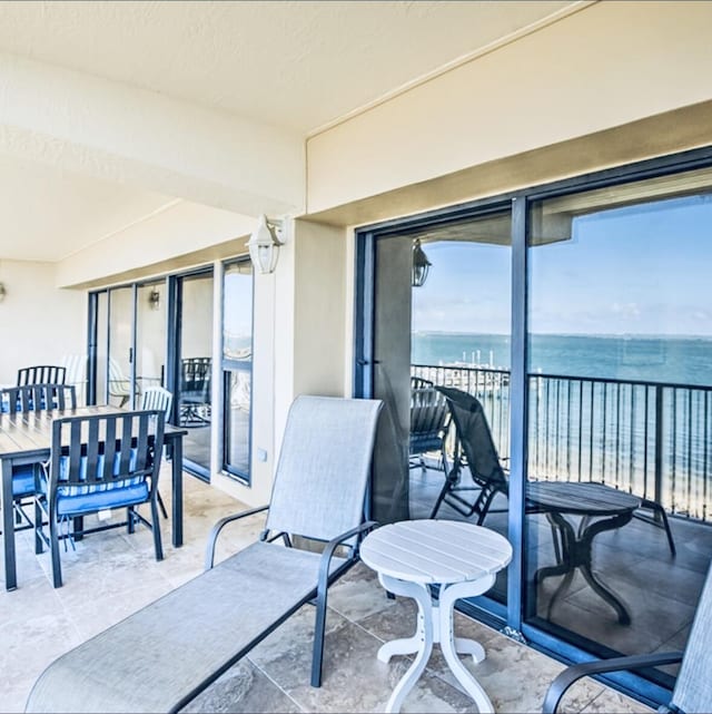 balcony featuring a water view