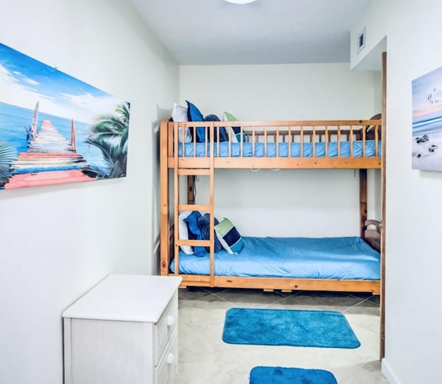 bedroom featuring light tile patterned flooring