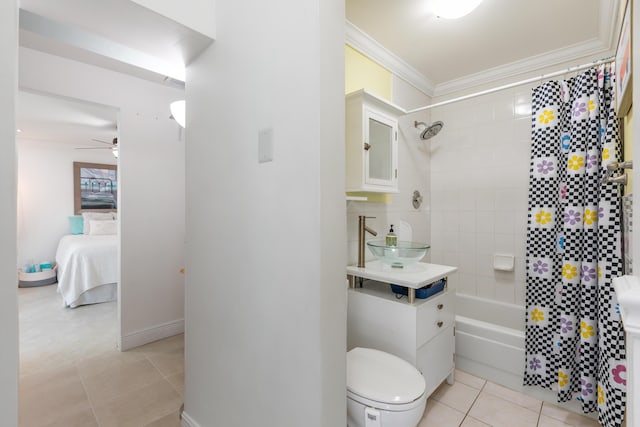 full bathroom featuring sink, ornamental molding, tiled shower / bath, tile patterned floors, and toilet