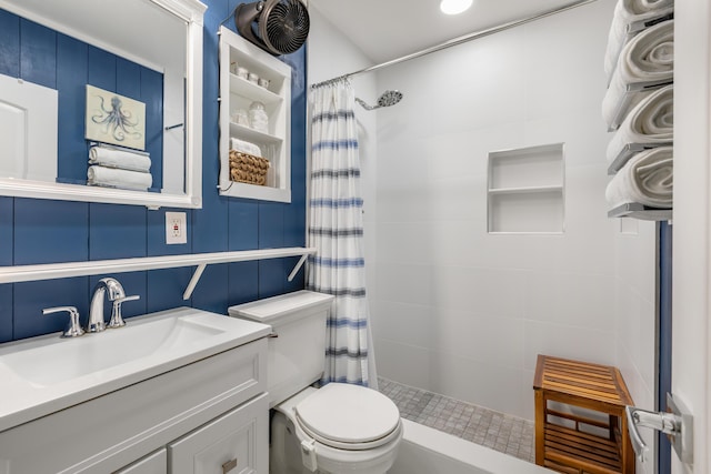 bathroom with vanity, toilet, and curtained shower