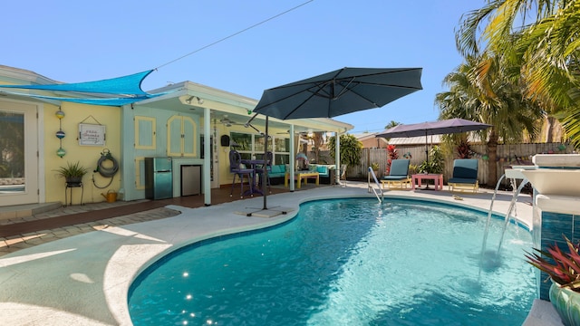 view of swimming pool featuring a patio